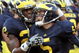 ANN ARBOR, MI - SEPTEMBER 12: Quarterback Tate Forcier #5 of Michigan gets congratulated by teammate Darryl Stonum #22 after Forcier scored a touchdown late in the fourth quarter against Notre Dame at Michigan Stadium on September 12, 2009 in Ann Arbor, Michigan. (Photo by Domenic Centofanti/Getty Images)