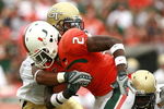 CORAL GABLES, FL - OCTOBER 13:  Running back Graig Cooper #2 of the Miami Hurricanes looks looks for room to run while taking on the Georgia Tech Yellow Jackets at the Orange Bowl on October 13, 2007 in Coral Gables, Florida. Georgia Tech defeated Miami 17-14.  (Photo by Doug Benc/Getty Images)
