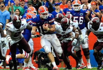 GAINESVILLE, FL - SEPTEMBER 12:  Tim Tebow #15 of the Florida Gators runs for yardage during the game against the Troy Trojans at Ben Hill Griffin Stadium on September 12, 2009 in Gainesville, Florida.  (Photo by Sam Greenwood/Getty Images)