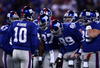 EAST RUTHERFORD, NJ - DECEMBER 21:  Quarterback Eli Manning #10 of the New York Giants talks to his team in a huddle before a play against the Carolina Panthers on December 21, 2008 at Giants Stadium in East Rutherford, New Jersey.  (Photo by Chris McGrath/Getty Images)
