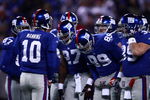 EAST RUTHERFORD, NJ - DECEMBER 21:  Quarterback Eli Manning #10 of the New York Giants talks to his team in a huddle before a play against the Carolina Panthers on December 21, 2008 at Giants Stadium in East Rutherford, New Jersey.  (Photo by Chris McGrath/Getty Images)