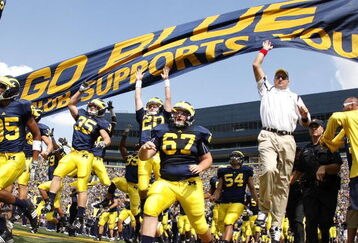 ANN ARBOR, MI - SEPTEMBER 05:  Head coach Rich Rodriguez enters the stadium with his team prior to playing the Western Michigan Broncos on September 5, 2009 at Michigan Stadium in Ann Arbor, Michigan.  (Photo by Gregory Shamus/Getty Images)