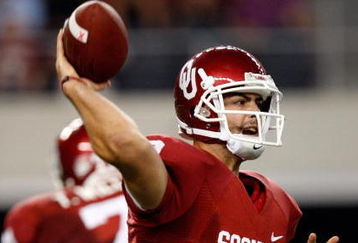 ARLINGTON, TX - SEPTEMBER 05:  Quarterback Landry Jones #12 of the Oklahoma Sooners at Cowboys Stadium on September 5, 2009 in Arlington, Texas.  (Photo by Ronald Martinez/Getty Images)