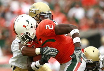 CORAL GABLES, FL - OCTOBER 13:  Running back Graig Cooper #2 of the Miami Hurricanes looks looks for room to run while taking on the Georgia Tech Yellow Jackets at the Orange Bowl on October 13, 2007 in Coral Gables, Florida. Georgia Tech defeated Miami 17-14.  (Photo by Doug Benc/Getty Images)