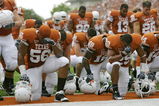 AUSTIN, TX - SEPTEMBER 5:  Members of the Texas Longhorns bow their heads together prior to their game against the Louisiana Monroe Warhawks on September 5, 2009 at Darrell K Royal-Texas Memorial Stadium in Austin, Texas. The Longhorns defeated the Warhawks 59-20. (Photo by Brian Bahr/Getty Images)