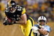 PITTSBURGH - SEPTEMBER 11: Heath Miller #83 of the Pittsburgh Steelers tries to gain a few more yards as Chris Hope #24 of the Tennessee Titans makes the tackle on September 11, 2009 at Heinz Field in Pittsburgh, Pennsylvania. The Steelers defeated the Titans 13-10 in overtime. (Photo by Elsa/Getty Images)