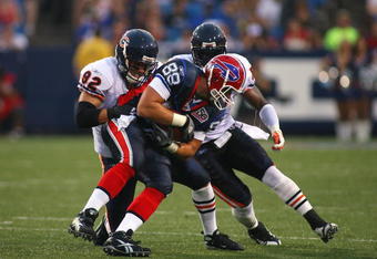ORCHARD PARK, NY - AUGUST 15:  Tight end Jonathan Stupar #88 of the Buffalo Bills is tackled by Hunter Hillenmeyer #92 and Jamar Williams #52 of the Chicago Bears during the preseason game on August 15, 2009 at Ralph Wilson Stadium in Orchard Park, New York. The Bills won 27-20. (Photo by Rick Stewart/Getty Images)