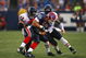 ORCHARD PARK, NY - AUGUST 15: Tight end Jonathan Stupar #88 of the Buffalo Bills is tackled by Hunter Hillenmeyer #92 and Jamar Williams #52 of the Chicago Bears during the preseason game on August 15, 2009 at Ralph Wilson Stadium in Orchard Park, New York. The Bills won 27-20. (Photo by Rick Stewart/Getty Images)