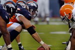 DENVER - AUGUST 25: Center Tom Nalen #66  of the Denver Broncos gets set to snap the ball during the pre-season football game against the Cleveland Browns on August 25, 2006 at Invesco Field at Mile High in Denver, Colorado.   (Photo by Steve Dykes/Getty Images)