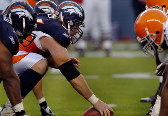 DENVER - AUGUST 25: Center Tom Nalen #66  of the Denver Broncos gets set to snap the ball during the pre-season football game against the Cleveland Browns on August 25, 2006 at Invesco Field at Mile High in Denver, Colorado.   (Photo by Steve Dykes/Getty Images)