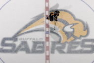 BUFFALO, NY - FEBRUARY 13: Adam Mair #22 of the Buffalo Sabres skates over the center ice emblem during play against the Toronto Maple Leafs on February 13, 2008 at HSBC Arena in Buffalo, New York. (Photo by Rick Stewart/Getty Images)