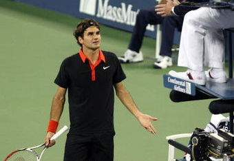 NEW YORK - SEPTEMBER 14:  Roger Federer of Switzerland (L) disputes a call in the fourth set tiebreak to chair judge Jake Garner during the Men�s Singles final on day fifteen of the 2009 U.S. Open at the USTA Billie Jean King National Tennis Center on September 14, 2009 in the Flushing neighborhood of the Queens borough of New York City.  (Photo by Nick Laham/Getty Images)