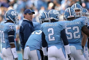 CHAPEL HILL, NC - NOVEMBER 22:  Head coach Butch Davis of the North Carolina Tar Heels talks to his players during their game against the North Carolina State Wolfpack at Kenan Stadium on November 22, 2008 in Chapel Hill, North Carolina.  (Photo by Streeter Lecka/Getty Images)
