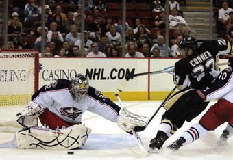 PITTSBURGH, PA - SEPTEMBER 15:  Chris Conner #23 of the Pittsburgh Penguins takes a shot on Mathieu Garon #32 of the Columbus Blue Jackets in the second period at Mellon Arena on September 15, 2009 in Pittsburgh, Pennsylvania.  (Photo by Justin K. Aller/Getty Images)