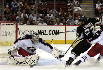 PITTSBURGH, PA - SEPTEMBER 15:  Chris Conner #23 of the Pittsburgh Penguins takes a shot on Mathieu Garon #32 of the Columbus Blue Jackets in the second period at Mellon Arena on September 15, 2009 in Pittsburgh, Pennsylvania.  (Photo by Justin K. Aller/Getty Images)