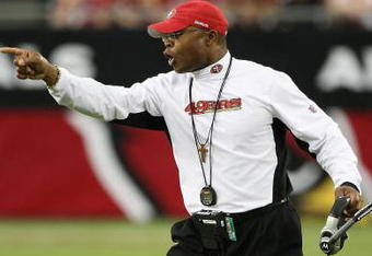 GLENDALE, AZ - SEPTEMBER 13:  Head coach  Mike Singletary of the San Francisco 49ers calls to players during the NFL game against the Arizona Cardinals at the Universtity of Phoenix Stadium on September 13, 2009 in Glendale, Arizona.  The 49ers defeated the Cardinals 20-16.  (Photo by Christian Petersen/Getty Images)
