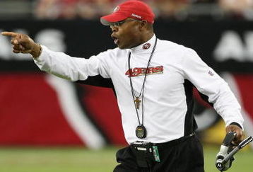 GLENDALE, AZ - SEPTEMBER 13:  Head coach  Mike Singletary of the San Francisco 49ers calls to players during the NFL game against the Arizona Cardinals at the Universtity of Phoenix Stadium on September 13, 2009 in Glendale, Arizona.  The 49ers defeated the Cardinals 20-16.  (Photo by Christian Petersen/Getty Images)