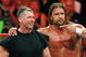 LAS VEGAS - AUGUST 24: World Wrestling Entertainment Inc. Chairman Vince McMahon (L) and wrestler Triple H appear in the ring during the WWE Monday Night Raw show at the Thomas & Mack Center August 24, 2009 in Las Vegas, Nevada. (Photo by Ethan Miller/Getty Images)