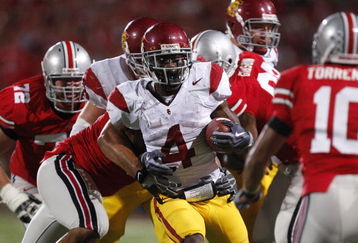 COLUMBUS, OH - SEPTEMBER 13:  Joe McKnight #4 of the Southern California Trojans looks for running room while playing the Ohio State Buckeyes on September 13, 2009 at Ohio Stadium in Columbus, Ohio. USC won the game 18-15. (Photo by Gregory Shamus/Getty Images)