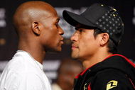 LAS VEGAS - SEPTEMBER 16: Boxers Floyd Mayweather Jr. (L) and Juan Manuel Marquez face off during their final news conference at the MGM Grand Hotel/Casino September 16, 2009 in Las Vegas, Nevada. The two will fight at the MGM Grand Garden Arena on September 19 in Las Vegas. (Photo by Ethan Miller/Getty Images)