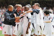 CARDIFF, UNITED KINGDOM - MAY 13:  (L-R) Bobby Zamora and Teddy Sheringham and members of the West Ham United team celebrate with Paul Konchesky after he scores his sides third goal during the FA Cup Final match between Liverpool and West Ham United at the Millennium Stadium on May 13, 2006 in Cardiff, Wales.  (Photo by Phil Cole/Getty Images)