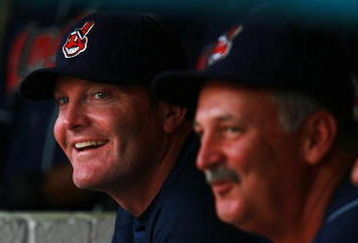 MIAMI - JUNE 12:   Manager Eric Wedge #22 of the Cleveland Indians shares a laugh on the bench with pitching coach Carl Willis #51 (C) and third baseman Casey Blake #1 (R) in the first inning against the Florida Marlins during interleague play at Dolphin Stadium on June12, 2007 in Miami, Florida.  (Photo by Doug Benc/Getty Images)