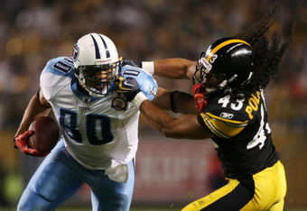 PITTSBURGH - SEPTEMBER 10:  Safety Troy Polamalu #43 of the Pittsburgh Steelers gets a penalty for holding the face mask of tight end Bo Scaife #80 of the Tennessee Titans during the second quarter of the NFL season opener at Heinz Field on September 10, 2009 in Pittsburgh, Pennsylvania. (Photo by Elsa/Getty Images)