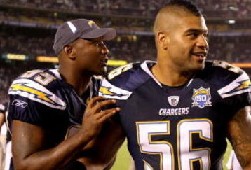 SAN DIEGO - SEPTEMBER 04:  Linebackers Shawne Merriman #56 and Shaun Phillips #95 of the San Diego Chargers joke on the sidelines during the game with the San Francisco 49ers on September 4, 2009 at Qualcomm Stadium in San Diego, California. The Chargers won 26-7.  (Photo by Stephen Dunn/Getty Images)