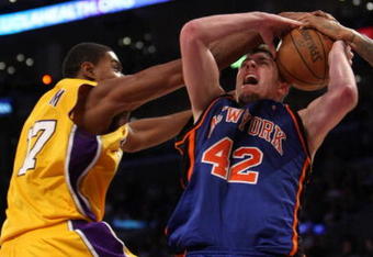 LOS ANGELES, CA - DECEMBER 16:  David Lee #42 of the New York Knicks fights to control the ball against Andrew Bynum #17 of the Los Angeles Lakers at Staples Center December 16, 2008 in Los Angeles, California.  The Lakers won 116-114.  NOTE TO USER: User expressly acknowledges and agrees that, by downloading and/or using this Photograph, user is consenting to the terms and conditions of the Getty Images License Agreement.  (Photo by Stephen Dunn/Getty Images)