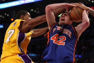 LOS ANGELES, CA - DECEMBER 16:  David Lee #42 of the New York Knicks fights to control the ball against Andrew Bynum #17 of the Los Angeles Lakers at Staples Center December 16, 2008 in Los Angeles, California.  The Lakers won 116-114.  NOTE TO USER: User expressly acknowledges and agrees that, by downloading and/or using this Photograph, user is consenting to the terms and conditions of the Getty Images License Agreement.  (Photo by Stephen Dunn/Getty Images)