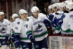 ANAHEIM, CA - SEPTEMBER 17:  Steve Bernier #18 of the Vancouver Canucks receives high fives from the bench after scoring a goal in the first period against the Anaheim Ducks at the Honda Center on September 17, 2009 in Anaheim, California.  (Photo by Jeff Gross/Getty Images)