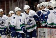 ANAHEIM, CA - SEPTEMBER 17: Steve Bernier #18 of the Vancouver Canucks receives high fives from the bench after scoring a goal in the first period against the Anaheim Ducks at the Honda Center on September 17, 2009 in Anaheim, California. (Photo by Jeff Gross/Getty Images)