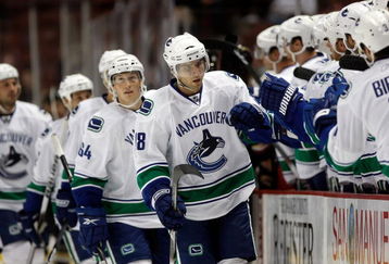 ANAHEIM, CA - SEPTEMBER 17:  Steve Bernier #18 of the Vancouver Canucks receives high fives from the bench after scoring a goal in the first period against the Anaheim Ducks at the Honda Center on September 17, 2009 in Anaheim, California.  (Photo by Jeff Gross/Getty Images)