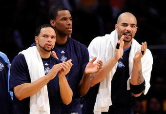 LOS ANGELES, CA - APRIL 27:  (lL-R) Deron Williams #8, Jarron Collins #31 and Carlos Boozer #5 of the Utah Jazz cheer on their team in the fourth quarter against the Los Angeles Lakers in Game Five of the Western Conference Quarterfinals during the 2009 NBA Playoffs at Staples Center on April 27, 2009 in Los Angeles, California. NOTE TO USER: User expressly acknowledges and agrees that, by downloading and or using this photograph, User is consenting to the terms and conditions of the Getty Images License Agreement.  (Photo by Kevork Djansezian/Getty Images)
