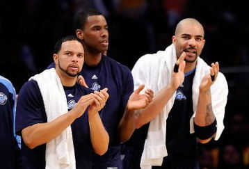 LOS ANGELES, CA - APRIL 27:  (lL-R) Deron Williams #8, Jarron Collins #31 and Carlos Boozer #5 of the Utah Jazz cheer on their team in the fourth quarter against the Los Angeles Lakers in Game Five of the Western Conference Quarterfinals during the 2009 NBA Playoffs at Staples Center on April 27, 2009 in Los Angeles, California. NOTE TO USER: User expressly acknowledges and agrees that, by downloading and or using this photograph, User is consenting to the terms and conditions of the Getty Images License Agreement.  (Photo by Kevork Djansezian/Getty Images)