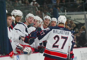 DENVER - DECEMBER 5:  Manny Malhotra #27 of the Columbus Blue Jackets skates to the bench against the Colorado Avalanche on December 5, 2006 at the Pepsi Center in Denver, Colorado. The Blue Jackets won 3-0. (Photo by Bruce Bennett/Getty Images) 