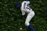 CHICAGO - AUGUST 28: Alfonso Soriano #12 of the Chicago Cubs hits the outfield wall after missing a catch against the New York Mets on August 28, 2009 at Wrigley Field in Chicago, Illinois. The Cubs defeated the Mets 5-2. (Photo by Jonathan Daniel/Getty Images)