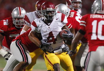 COLUMBUS, OH - SEPTEMBER 13:  Joe McKnight #4 of the Southern California Trojans looks for running room while playing the Ohio State Buckeyes on September 13, 2009 at Ohio Stadium in Columbus, Ohio. USC won the game 18-15. (Photo by Gregory Shamus/Getty Images)