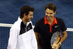 NEW YORK - SEPTEMBER 14:  (L-R) Juan Martin Del Potro of Argentina and Roger Federer of Switzerland stand with their trophies after the Men's Singles final on day fifteen of the 2009 U.S. Open at the USTA Billie Jean King National Tennis Center on September 14, 2009 in the Flushing neighborhood of the Queens borough of New York City. Del Potro defeated Federer 3-6, 7-6 (7), 4-6, 7-6 (7), 6-2.  (Photo by Julian Finney/Getty Images)