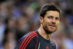 BARCELONA, SPAIN - AUGUST 02:  Xabi Alonso of Liverpool smiles during his warm up reacting to shouts from fans regarding his possible move to Real Madrid during the pre-season friendly match between Espanyol and Liverpool at the Nuevo Estadio de Cornella-El Prat on August 2, 2009 in Barcelona, Spain. Espanyol won the match 3-0.  (Photo by Jasper Juinen/Getty Images)