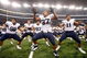 ARLINGTON, TX - SEPTEMBER 05:  (L-R) Romney Fuga #98, Vic So'oto #37 and Manase Tonga #11 of the Brigham Young Cougars celebrate a 14-13 win against the Oklahoma Sooners at Cowboys Stadium on September 5, 2009 in Arlington, Texas.  (Photo by Ronald Martinez/Getty Images)