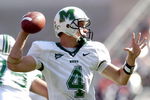 COLUMBUS, OH - SEPTEMBER 11:  Quarterback Stan Hill #4 of the Marshall Thundering Herd throws a pass against the Ohio State Buckeyes on September 11, 2004 at Ohio Stadium in Columbus, Ohio.  Ohio State defeated Marshall 24-21.   (Photo by David Maxwell/Getty Images)