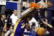 AUBURN HILLS, MI - JUNE 15:  Kobe Bryant #8 of the Los Angeles Lakers hangs from the rim after dunking the basketball while defended by Lindsey Hunter #10 of the Detroit Pistons during the second quarter in Game five of the 2004 NBA Finals on June 15, 2004 at The Palace of Auburn Hills in Auburn Hills, Michigan.  NOTE TO USER: User expressly acknowledges and agrees that, by downloading and or using this photograph, User is consenting to the terms and conditions of the Getty Images License Agreement.  (Photo by Tom Pidgeon/Getty Images)