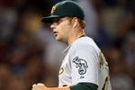 BOSTON - JULY 06:  Starting pitcher Brett Anderson #49 of the Oakland Athletics celebrates his shutout against the Boston Red Sox on July 6, 2009 at Fenway Park in Boston, Massachusetts. The Athletics defeated the Red Sox 6-0. (Photo by Elsa/Getty Images)
