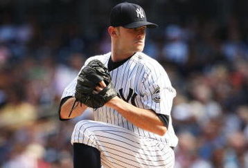 NEW YORK - AUGUST 27:  David Robertson #30 of The New York Yankees in action against The Texas Rangers during their game on August 27th, 2009 at Yankee Stadium in the Bronx Borough of New York.  (Photo by Al Bello/Getty Images)