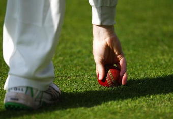 LONDON, ENGLAND - APRIL 22:  A fielder picks up the ball during day one of the LV County Championship Division 2 match between Middlesex and Glamorgan at Lords on April 22, 2009 in London, England.  (Photo by Ryan Pierse/Getty Images)
