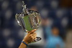 NEW YORK - SEPTEMBER 14:  Juan Martin Del Potro of Argentina holds the championship trophy after defeating Roger Federer of Switzerland in the Men's Singles final on day fifteen of the 2009 U.S. Open at the USTA Billie Jean King National Tennis Center on September 14, 2009 in the Flushing neighborhood of the Queens borough of New York City. Del Potro defeated Federer 3-6, 7-6 (7), 4-6, 7-6 (7), 6-2.  (Photo by Clive Brunskill/Getty Images)