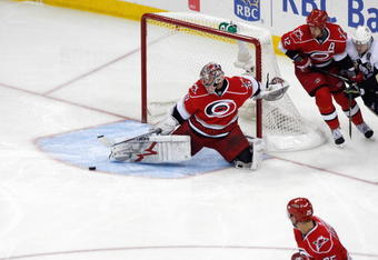 RALEIGH, NC - MAY 26:  Goalie Cam Ward #30 of the Carolina Hurricanes deflects the puck against the Pittsburgh Penguins during Game Four of the Eastern Conference Championship Round of the 2009 Stanley Cup Playoffs at RBC Center on May 26, 2009 in Raleigh, North Carolina.   (Photo by Kevin C. Cox/Getty Images)