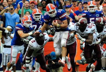 GAINESVILLE, FL - SEPTEMBER 12:  Tim Tebow #15 of the Florida Gators runs for yardage during the game against the Troy Trojans at Ben Hill Griffin Stadium on September 12, 2009 in Gainesville, Florida.  (Photo by Sam Greenwood/Getty Images)
