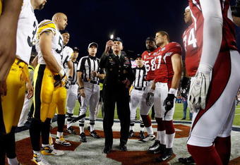 TAMPA, FL - FEBRUARY 01:  General David H. Petraeus, commander of the United States Central Command, performs the coin toss before Super Bowl XLIII between the Arizona Cardinals and the Pittsburgh Steelers on February 1, 2009 at Raymond James Stadium in Tampa, Florida.  (Photo by Jamie Squire/Getty Images)